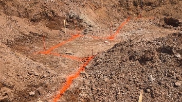 Construction site with surveyor layout stakes